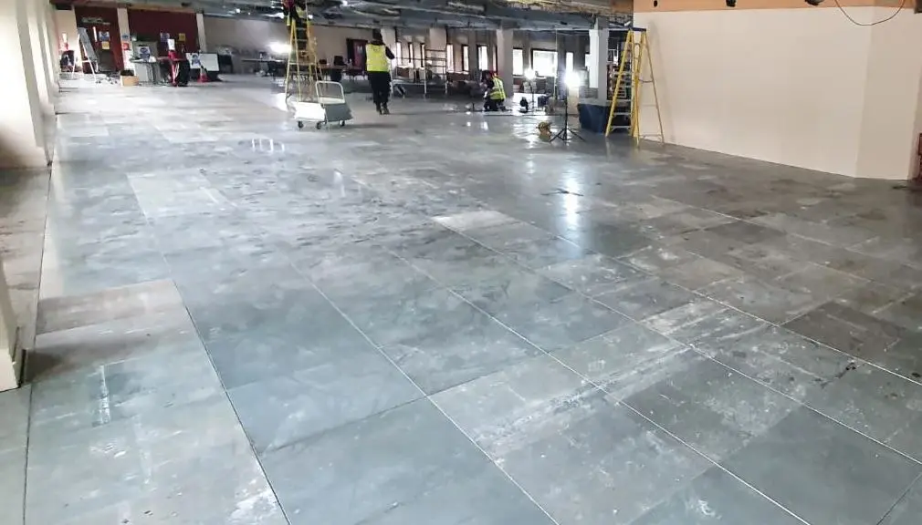 Recycled raised access floor panels being installed BJM Flooring