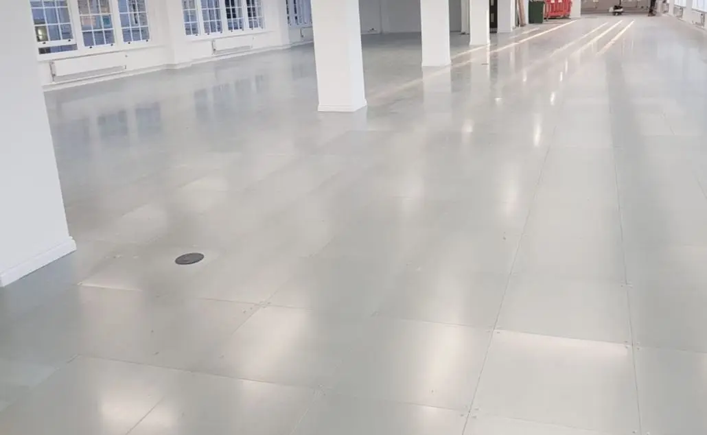 White raised access floor panels in a refurbished office BJM Flooring